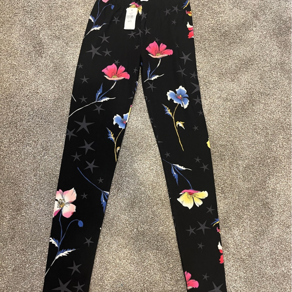 Gap kids. Size 10.  Black leggings with flowers and stars.  New with tags